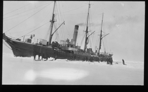 Image of Vessel in ice; men with seals near